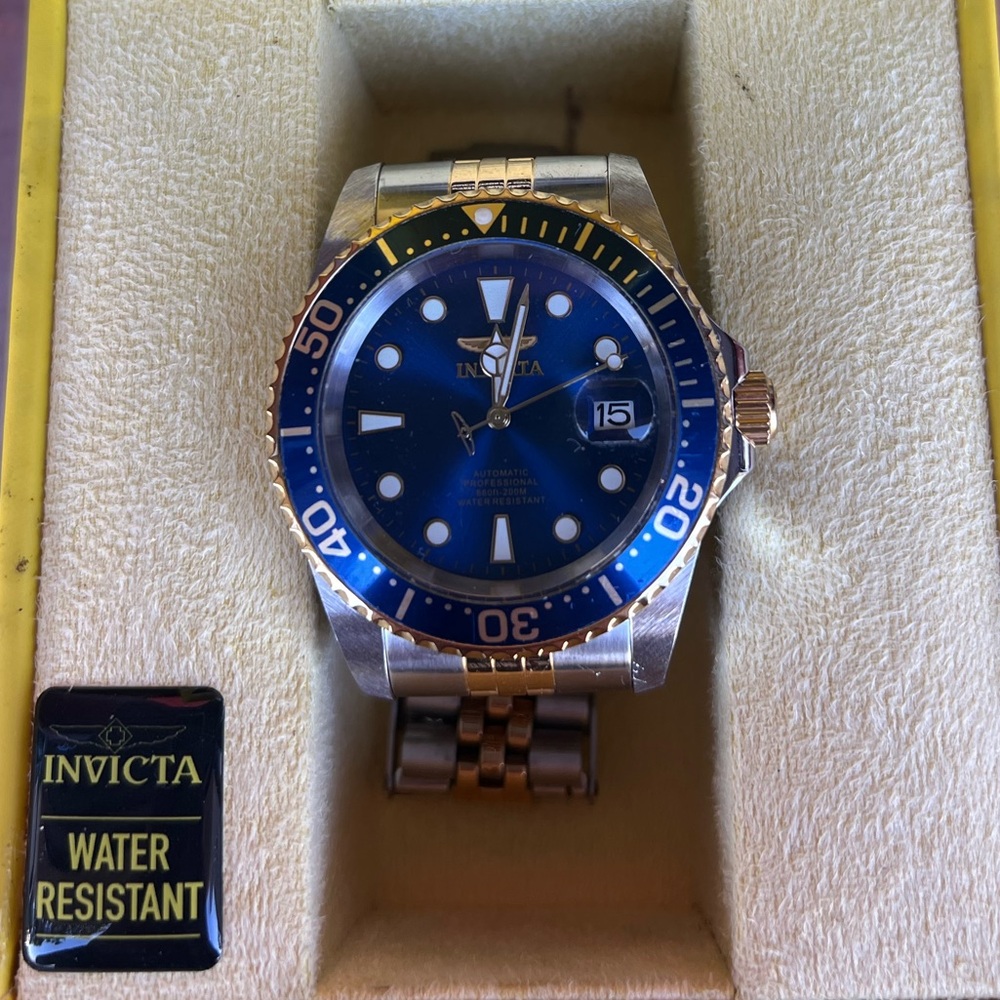 Men’s Invicta Watch, 30093 with box.  Silver and gold with a blue face.